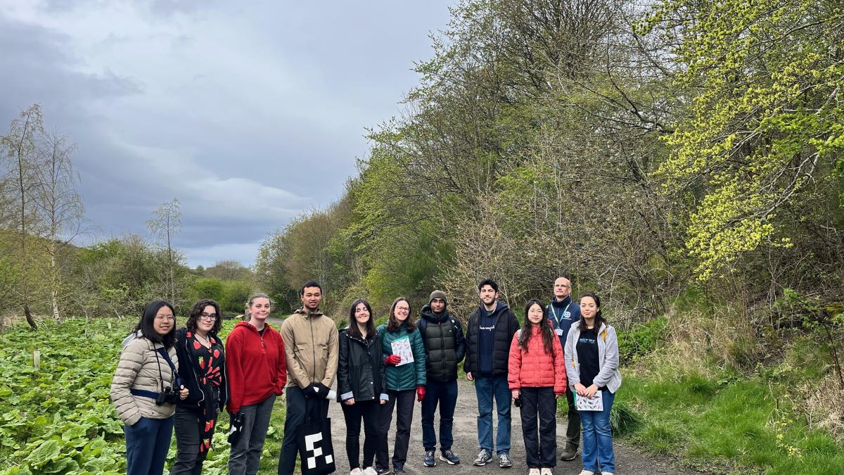 Group of students standing outside on the Kings Buildings campus before participating in the Birdsong Walk event