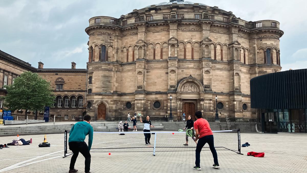 People playing pickle ball outside McEwan Hall