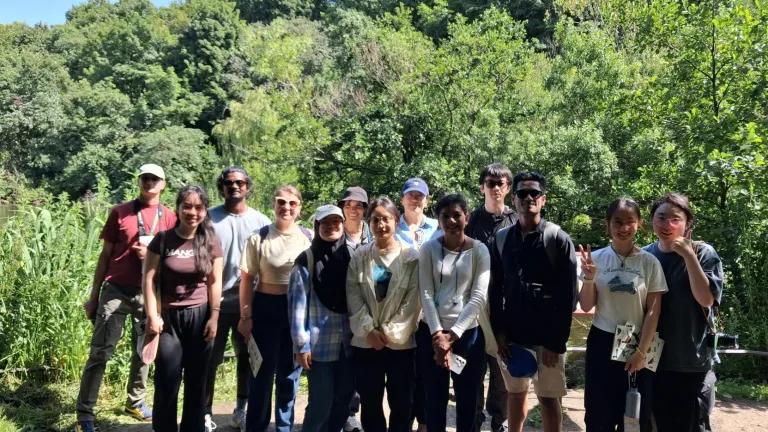 Group photo of students and Chris, wellbeing adviser, on nature walk