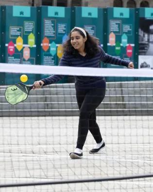 Girl playing paddleball
